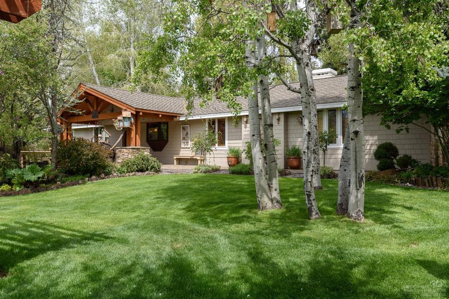 This lovely small acreage in Bend's west side is like no other offering. With four acres of irrigation on the 4.23 acre property, a vast lawn sets off the home, 4-car garage with heated shop, and a 3-car heated garage. A separate studio is a great mixed use option. Every room in the home has been lovingly remodeled with accents that create a unique style like stone and brick accent walls, intricate tile detail, hammered copper sinks, the custom-made granite island in the kitchen, gorgeous master steam shower and much more. Tall poplars line the driveway and a row of aspens set off the fence. The back patio looks out to two water features, koi pond & canal with complete privacy. This property is in Bend city limits and is sub-divisible; ask agent for details.