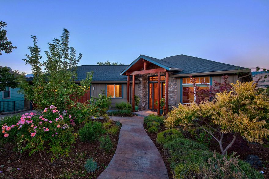 Luxury and views galore! Stunning newer home with 3,477 square feet of unbelievable craftsmanship. Fabulous 4 bedroom / 3.5 bath home plus an office, game room, and spacious 600 square foot bonus room. The home features two luxurious master suites with soaking/jetted tubs, walk-in closets, and a fireplace. Absolutely breathtaking views of Pompadour Bluff, Grizzly Peak, and Pilot Rock. The quality of this home is unmatched, including granite countertops, 300 bottle wine cellar, heated Travertine flooring, dishwasher drawers.  Brazilian Walnut hardwood flooring, new carpet, new paint, energy efficient heating, high efficiency Bryant gas furnace, and Hardi-Plank siding to name a few. Low maintenance landscaping with an energy efficient watering system completes this home. Minutes to downtown Ashland, the Oak Knoll Golf Course, schools, and shopping.