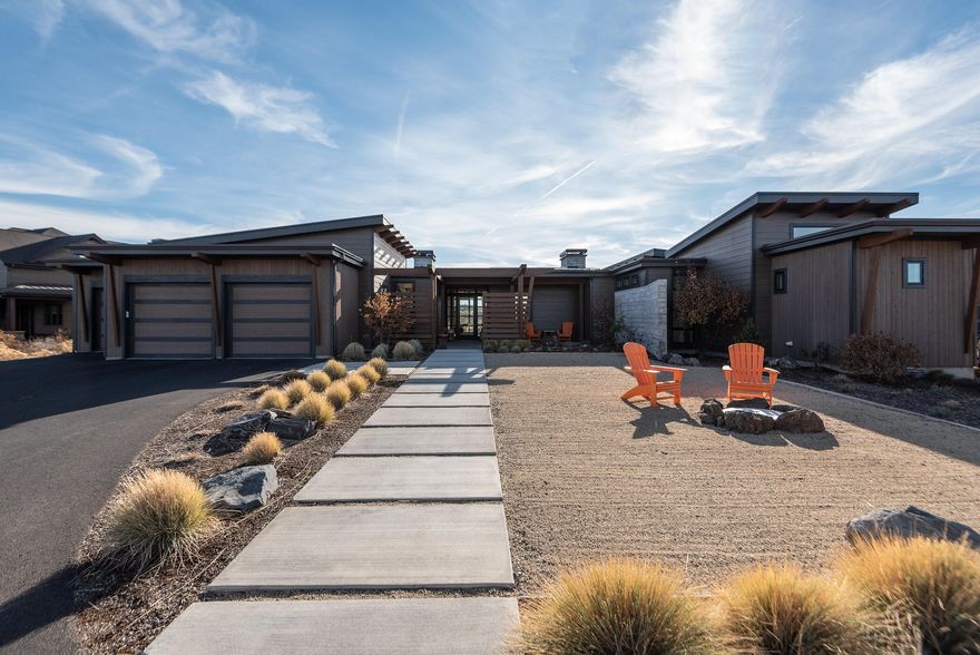 Take in breathtaking mountain views from this extraordinary, single level contemporary home situated on a .87 acre lot. This custom built home features ample natural light, exposed beams, wood burning fireplace, metal roof, split oak cabinets and beautiful hand scraped white oak floors plus so much more! 3 bedrooms all with en suites, plus a spacious office located in the main home, detached casita with full bathroom makes this home an excellent option for so many types of households. The outdoor space between the home and casita offers a crushed granite approach with a gas fire pit making it a fun outdoor entertaining space for corn hole or bocce ball . Through the la cantina style doors out back you'll find multiple seating areas, outdoor gas fireplace and low maintenance landscaping. Located in Tartan Druim, a private, gated cul-de-sac community within Tetherow bordering The Deschutes National Forest. Come be a part of this highly sought after community