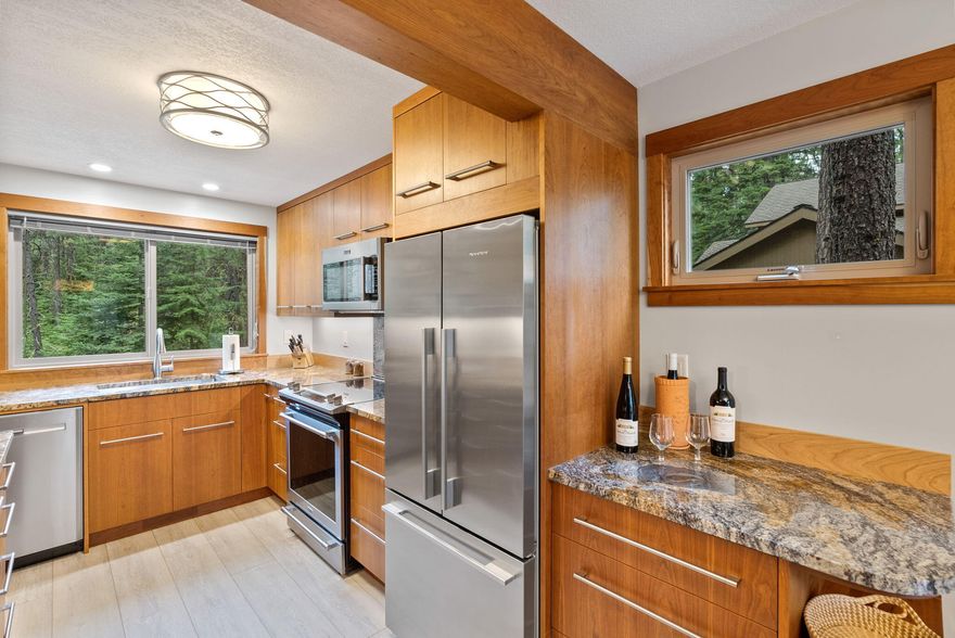 Discover your private oasis nestled against the stunning backdrop of the National Forest. This tranquil retreat offers a perfect blend of serenity and modern comfort. Recently updated, the kitchen and bathroom exude a contemporary flair while preserving the beloved rustic cabin charm of Black Butte Ranch. The kitchen is a homeowner's dream, featuring sleek new granite countertops, cherry cabinetry, state-of-the-art stainless steel appliances, and stylish wood-grained flooring. A versatile bonus area on the lower level provides an additional haven for relaxation and recreation. Step outside onto the expansive wrap-around deck, a perfect spot for taking in the breathtaking forest views.The primary bedroom and guest bedroom boasts their own private balcony, ideal spaces for unwinding and savoring the tranquil surroundings.