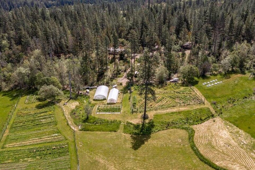 Newly renovated November 2025 with new paint, floors and improvements. Welcome to the Williams Valley, known for its beauty and rural lifestyles. Owner carry terms with a large down. A deck overlooks your domain to the West where you can view the gorgeous sunsets and wildlife ambling across the large pasture. This amazing property is partially fenced and cross fenced and includes fenced garden areas. There are also 2 greenhouse frames, irrigation rights and A strong well (28 GPM when drilled) produces plenty of water for the home and garden. There are several RV hook ups/pads with water and power to them. The potential for self sustainable living is all right here. This private setting is not viewable from the Rd. This property is truly a hidden gem, partly wooded for privacy and part fertile pasture for food production and animals Appointment only please. Appointment only Please.