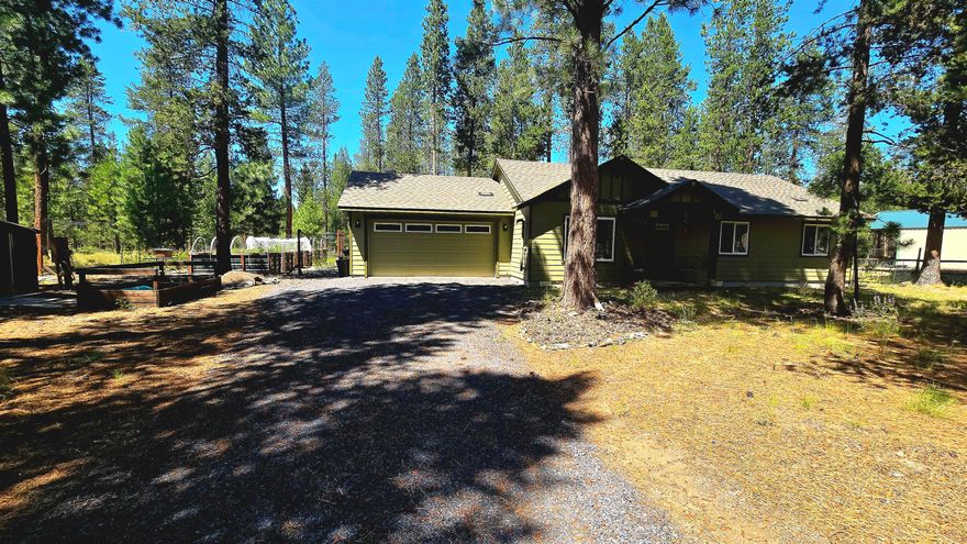 Located in Wagon Trail Ranch, this beautiful 3-bedroom, 2-bath home sits on nearly an acre. Thoughtfully designed, kitchen with island features solid surface countertops and with surprisingly a lot of storage, making it perfect for both everyday meals and entertaining guests.

Step outside and immerse yourself in nature, whether soaking in the small hot tub under the stars or tending to the raised garden beds with drip irrigation. The fully fenced garden area keeps the deer at bay, ensuring your plants thrive. Yet allows you to watch them as they travel the neighborhood. 

Inside, comfort is key. Stay cool in summer with a mini-split AC, and enjoy cozy winter nights by the efficient pellet stove. The attached garage adds convenience.

Wagon Trail Ranch community enhances your lifestyle with access to a pool, picnic area, and the tranquil Little Deschutes River. This property offers the perfect blend of rural serenity and modern convenience—schedule a showing today!