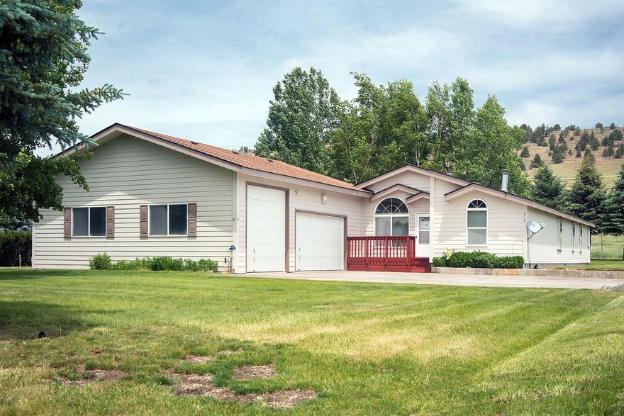 Small acreage close to town with wonderful views on 8.5 acres. Large open floor plan with abundant natural light and 12 ft ceilings. 3 bedrooms, 2 full baths include a master suite featuring walk in closet, double sinks and walk out door to the patio. Fuqua Manufactured home with built in displays and fireplace 2X6 construction and new 50 year shingles. Windows surround the dinning room with views to the mountain and yard. Home sites on 1 acres with full mature landscape trees and sprinkler system. Attached 3 car garage includes work bench area at the rear, storage cabinets and a drive through RV 14 ft doors. Outdoor features include patio, large metal storage building, drive through garden shed, fenced and cross fenced with entry gate, blacktop and concrete driveway. Ample parking, visitors can bring the RV, and hook up to the dump, power and water. Private well has 8 inch steel casing all the way down. There is about 6 acres of pasture land.