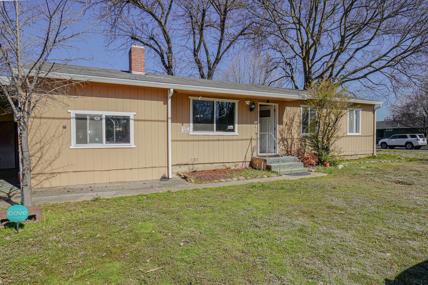 Rare opportunity to purchase a home that has 3 bedrooms and 1 bathroom plus an attached, but separate space, with living area, kitchen, full bathroom and bedroom. The Main living space has real hard wood floors, big kitchen with ample cabinets, nice sized bedrooms, full bath with tub shower and new heat pump in 2020. The second portion of the home would be great for a family member or a little extra income. The property also has a carport, large size side yard, backyard with patio and it's a corner lot. The central location of the property is great for shopping, schools, medical and entertainment. Call for your tour.