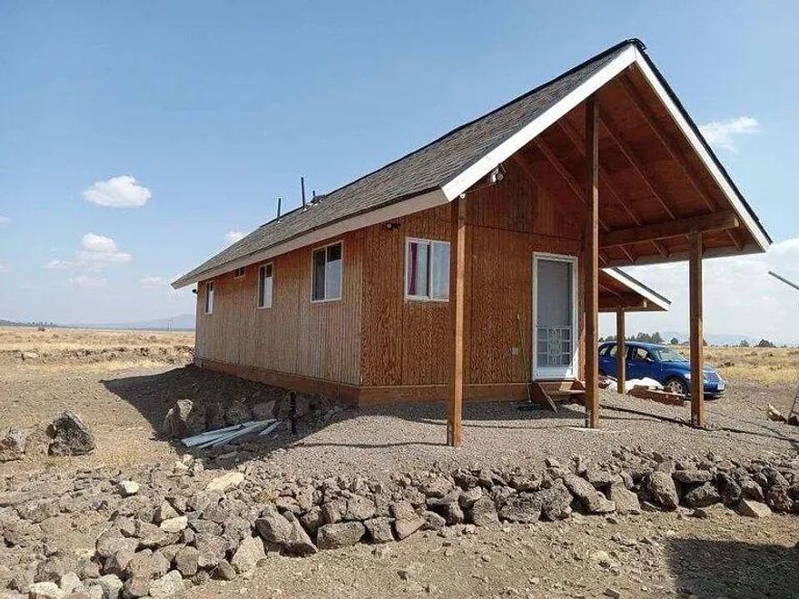 Looking for a small getaway? Come check out this 1 bedroom 1 bath cabin overlooks the Sprague River valley on a 1,56 acre parcel . House has 1000 watts of solar panels, 1 inverter and a charge controller, small washer and dryer, electric water heater, 30 gallons a minute well, 1200 gallon water storage tank with 12volt pump for household use, concrete pad well house, propane hookups for cooking stove and gas dryer and water heater.