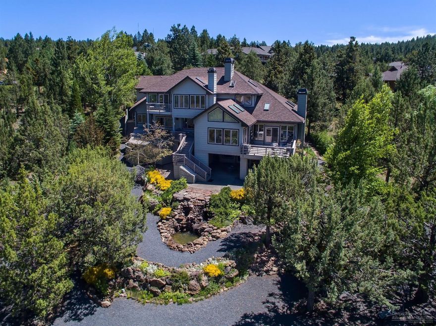 Enjoy the stunning Panoramic Cascade Mountain View from nearly every room in this custom home. This very light & bright multigenerational flowing plan w/bamboo hardwood floors & vaulted ceilings. A charming kitchen, lg. center island, slab granite & sunroom to enjoy the glorious views. The master suite features a floor-to-ceiling fireplace & private deck. Lower level steps you down to the 20x24 indoor pool w/access to the lower patio & optional fitness room. Mature xeriscape garden, pathways & water-feature