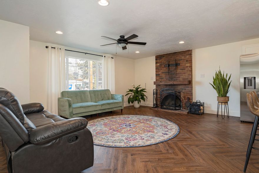 This extensively remodeled home is bright and shiny and move-in ready! You're greeted as you enter by a nice open living area with a cozy fireplace and new vinyl flooring in a beautiful herringbone pattern. The kitchen is all brand new with granite counters, new appliances, new cabinets, a new sink, a large island that has bar seating, and tons of storage. One of the guest bedrooms comes equipped with a fun and functional built-in bed complete with an electric outlet, a reading light, shelves, drawers, and a place to hang your clothes. Both bathrooms are sparkly and new with modern, stylish fixtures. All of the windows have been replaced and the exterior was recently painted. There's nothing left to do except move in!