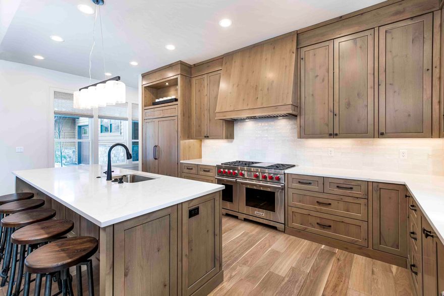 Discover the epitome of luxury living in this breathtaking NW-style home located in the exclusive Caldera Springs, nestled against the tranquil backdrop of Preservation Park. This serene property provides the perfect escape from the hustle and bustle of everyday life. With ample gathering spaces, perfect for full time living or a vacation escape. The main level features three spacious on-suite bedrooms, a great room, a gourmet kitchen, a dining area, a laundry/mudroom, a powder bath, and an expansive covered paver patio that's perfect for entertaining. Upstairs, you'll find two more luxurious on-suite bedrooms, as well as a recreation/bunk room that's perfect for kids or guests. This home is beautifully appointed with distressed wood beams, custom cabinetry, rich woods, solid surfaces, designer tile, and high-end appliances. Escape the ordinary and embrace unparalleled luxury in this truly remarkable home.