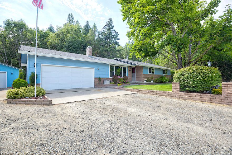 Don't miss your chance at this beautifully remodeled 4 bedroom, 2 bath home tucked away in a quiet New Hope neighborhood. The interior has been thoughtfully updated with a clean, modern feel from top to bottom. Enjoy a cozy living room with a wood-burning fireplace and a galley-style kitchen that flows into an oversized pantry. The spacious primary bedroom has an en suite featuring a stunning floor-to-ceiling tile walk-in shower, while the additional bedrooms and second bath offer plenty of room for family or guests. Step outside to a show-stopping backyard! It has been professionally landscaped, filled with vibrant flowers, and is bordered by a seasonal creek. The 750 sq. ft. detached shop offers endless possibilities as a second garage, workshop, or potential ADU. Priced to sell, this one won't last!