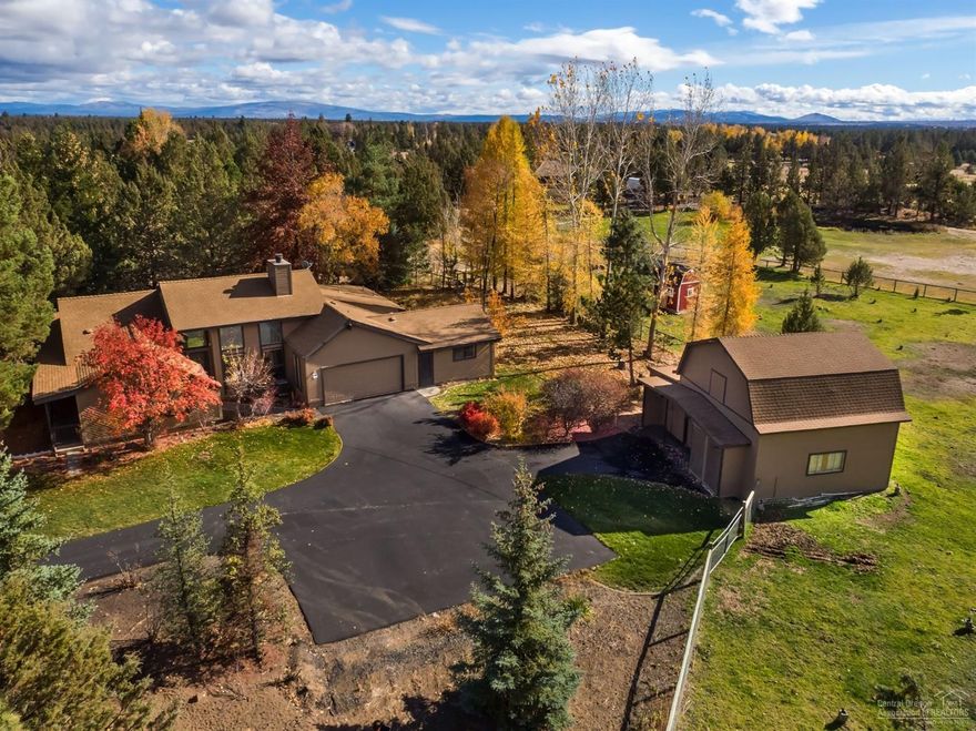 Single level home sits on 2 private acres just minutes from town. 4 bedrooms, 3 baths, family room, detached bonus room perfect for home office, vaulted ceilings, built ins, sunroom, central vac., fenced, mature landscaping, paved drive, covered deck, 36x34 detached garage/barn/shop plus two car attached garage. Fenced pasture w/1 acre irrigation.