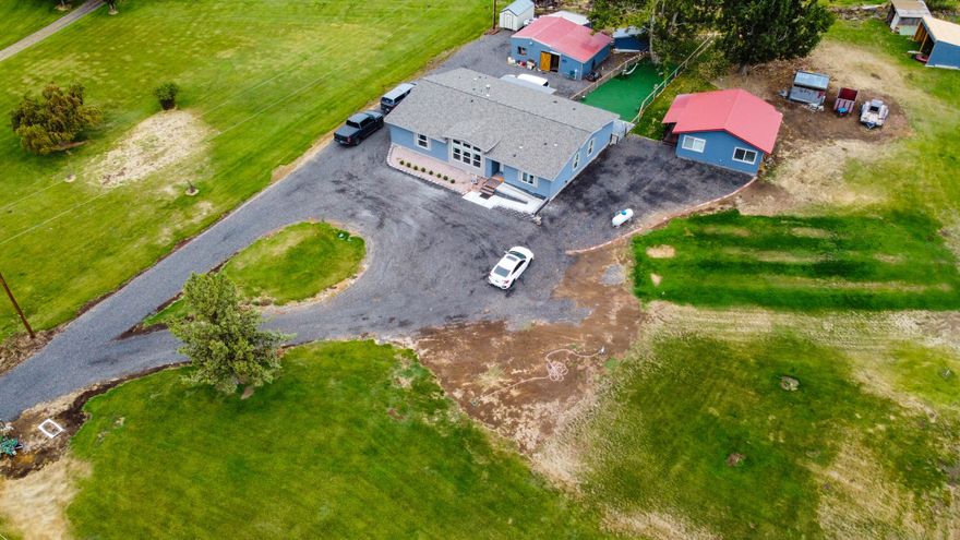 Newer Marlette located on a quiet road in the country, but only minutes to town. Has 2.2 acres irrigation, private well & ample parking for toys/equipment. Home features open floorplan, vaulted ceilings, heat pump w/AC, upgraded insulation & propane fireplace w/blower. Kitchen has breakfast bar, walnut cabinets & wine cabinet w/fridge. Spacious primary bedroom is highlighted by a custom barn door, walk-in closet & large double-head tile shower. There's also a spa room w/sauna & soaking tub as well as a mud room. Home is set-up for ADA access w/ramp at front door & 36'' interior doors. Exterior features include covered back deck/patio, beautifully landscaped w/mature trees among a quiet setting plus back pasture is setup w/underground sprinklers, pond & pump. Outbuildings include 576sqft. permitted office w/full kitchen & bath, 18'x24' machine garage that was completely rebuilt, a metal/woodworking shop, loafing shed and lean-to. Full foundation w/footings. Must-see to appreciate!