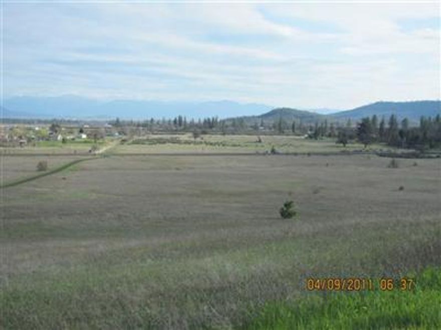 This beautiful 41.98 acres is all flat very useable land. Would make a super horse ranch or possible vineyard. It has been tilled and fertilized and produced hay years ago. Has views of Mt McLaughlin & Table Rock. Asphalt private road the length of property. The land is adjacent to 3080 HIghway 234, White City. Unbelievable how nice it is.