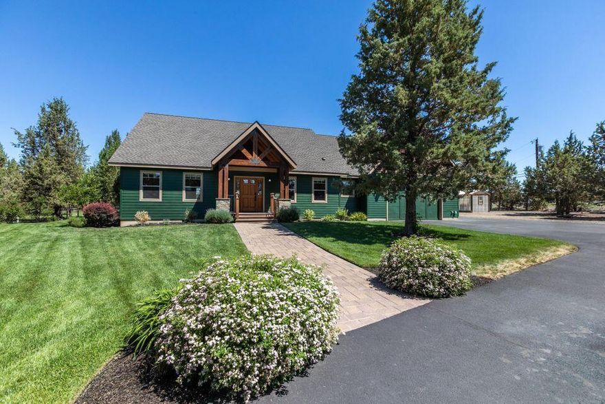 Stunning custom-built home on 3.87 acres nestled in Bend's desirable community of Tumalo. This private and elegantly appointed home offers 3 bedrooms + office, 2.5 baths and bonus room. Home features an open layout, vaulted ceilings, a gourmet kitchen and solid wood doors and trim throughout. This perfect floor plan gives you single level living with the exception of the large bonus room upstairs. Extensive primary bedroom and en-suite includes a soaking tub and huge walk-in closet. The elegant wood wrapped French doors take you outside to the covered Trex deck, paver patio, and beautifully landscaped yard. Property has a four-stall barn with power and water, greenhouse, chicken coop and storage shed. Do not miss the three car-garage, round about driveway and 50 Amp RV hookup. This property is fully fenced, gated, and has three acres of automatic irrigation. Perfect location only 5 minutes to Cascade Village, and 10-15 minutes to Downtown Bend, Old Mill District and Costco!