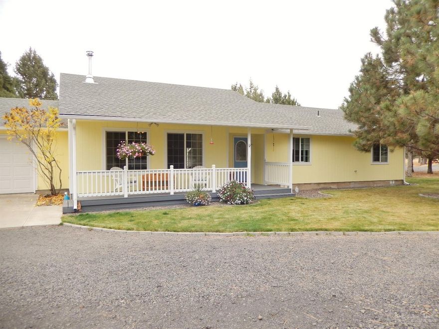 Quiet Country Home on 2 acres! This single level home has 3 bedrooms and 2.5 baths with a certified wood stove in the vaulted living room. Tiled floors in the kitchen and utility make clean up a cinch. There is a double car garage, wood shed, and two storage sheds with in-ground sprinklers in the yard. Property is fenced.