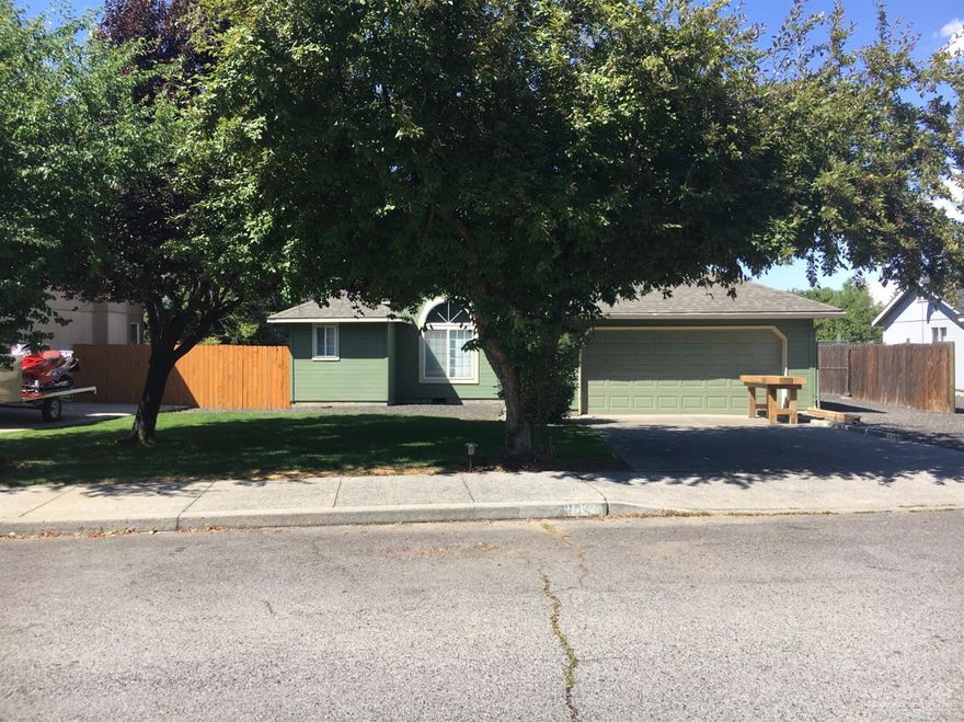 Well maintained single level charmer in NE Bend. Large lot with (narrow) RV parking, perfect for trailer or boat. Backyard is large and fenced in. Home gets tons of light from large windows that line the living room.. Huge master bedroom. Updated in 2017 with new exterior paint, new garage door, flooring, and new pellet stove. This home is ready for your personal touches. Easy to show, call your favorite real estate agent today for a showing.
