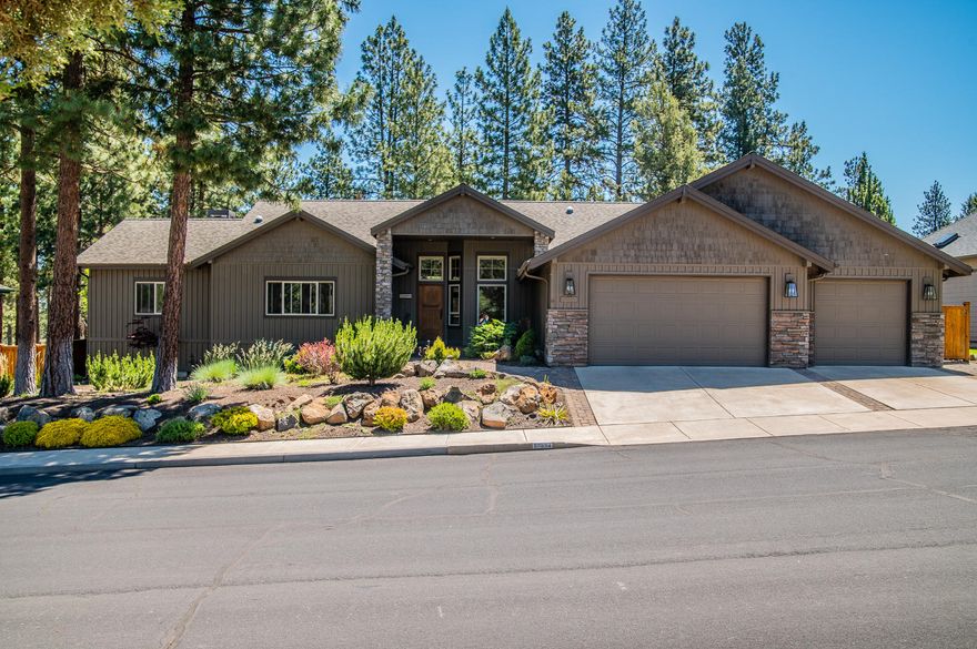 Move-in ready 2749 sqft, 4 bd/3 ba, 1-level home nestled on .21 acres in the desirable Mountain Pines neighborhood on the Bend Golf Club course. Across the street from an unbuilt natural comm area, looking out onto the 5th fairway shielded by canopying evergreen trees, the view gives this location a feeling of complete prvcy. Sit on the ext'd back deck and watch quails and deer play. Dream location for the golf enthusiast; even if golf isn't your thing, this view and location cannot be beat. Home has been completely custom remodeled incl new upgraded appliances, hickory hrdwd flrs, plush carpet in 2 of the bds, and a carpet inlay in the gr rm, gas firepls in both lrg lvg areas, beautiful and tastefully designed primary ba and lrg walk-in closet.The oversized 4-car garage with epoxy floors is for 2 side-by-side w/ 2 tandem spaces.