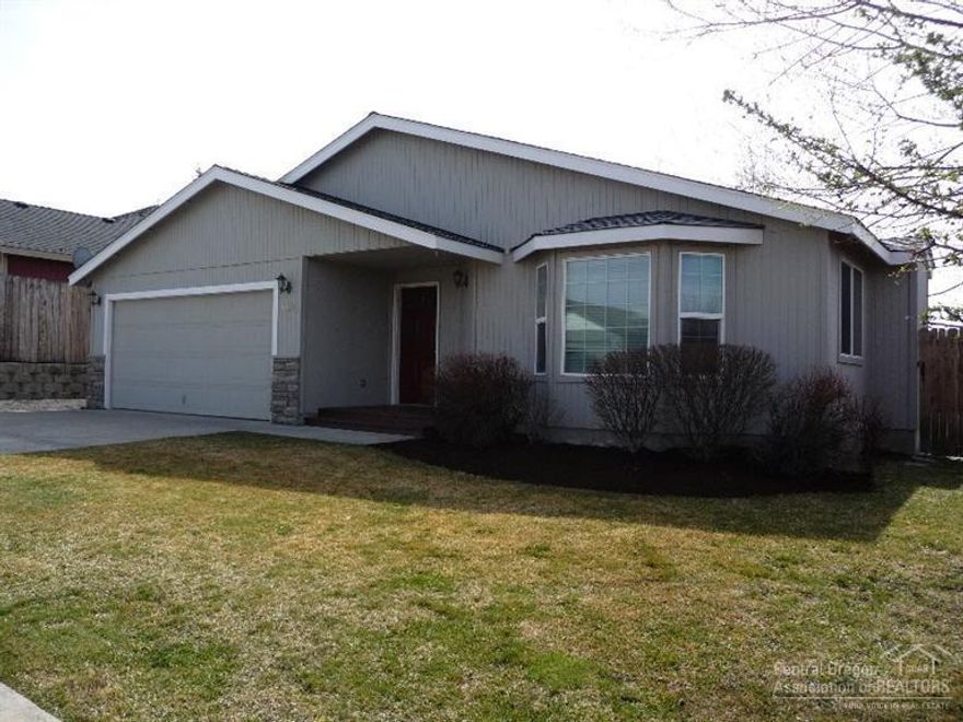 SINGLE-level home in NE Bend close to shopping, schools & hospital. Fully fenced yard that is landscaped with sprinklers. Gas fireplace, A/C, Tile flooring and Brand new carpet in the home. Includes all kitchen appliances and washer/dryer. Brand New Microwave.....New Interior Paint. Mountain views from the front yard. Quiet Dead-end street.