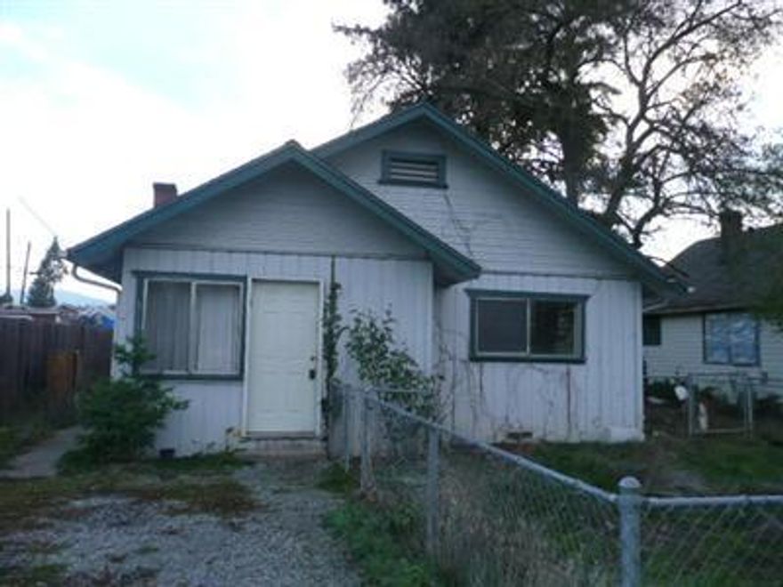 Front unit is 2 bedroom, 1 bath and back unit is 1 bedroom, 1 bath. Both units have laundry areas. Large garage for storage, backyard and alley access. Units need work, but good roof and great price.