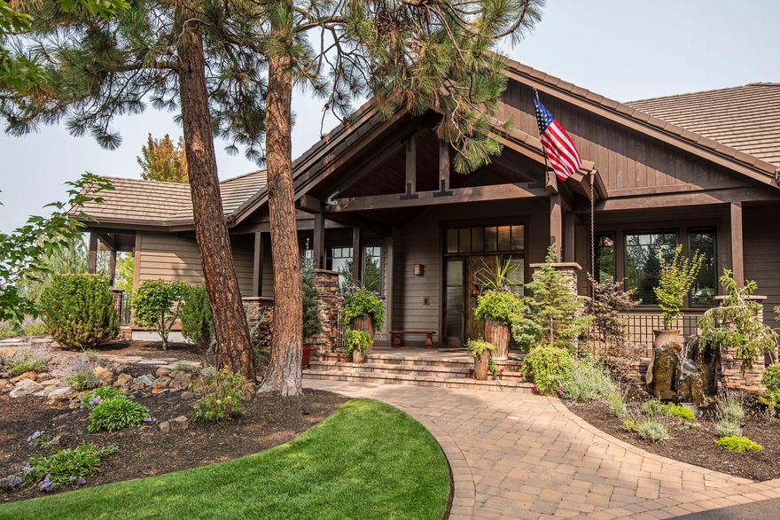 Beautiful home for entertaining, on slightly over an acre lot, overlooking the 11th green at Lost Tracks.  Grand entry, open beam vaults, through the great room, to three level deck, magnificent water feature with multiple falls, fire pit, golf course and mountain views. Hickory floors, knotty alder doors, cabinets and trim, slate, granite, wood clad windows, and four fireplaces. Gourmet kitchen, Decor appliances, large island, two sinks, warming drawer, double oven with beautiful views, formal dining room, corner fireplace, could accommodate a large gathering. Executive office with built-ins, delightful master suite, double sided fireplace, large soaking tub, heated floors, dual vanities, and a large walk-in closet. Main level living with 3 car garage, step up to the Cascade Theater and a bonus room perfect for sleep overs. this well appointed home has every detail & would be perfect for anyone who appreciates quality! Shown by appointment only.