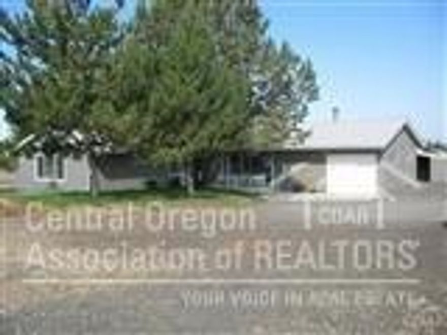 Need privacy?!?! This spacious 4 bedroom, 2 bath, 1888 sq ft home is situated on a 2.56 acres with views of Mt. Hood and Jefferson. Located in an established neighborhood, this home has been upgraded with tile flooring, new carpet, huge living room with French doors out to the large patio/covered porch.