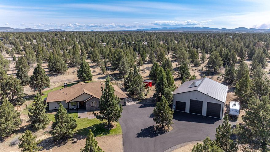 Embrace the tranquility and endless possibilities of country living in this impressive 2,800 sq ft home, perfectly situated on 10 sprawling acres. Dual primary suites offer luxurious privacy, a dedicated home office for seamless remote work, and a vast 3,000 sq ft shop ready for any hobby or project. Enjoy fresh eggs from your own chicken coop, cultivate your green thumb in the fenced garden, and unwind in your private barrel sauna. With a spacious laundry/mudroom and an inviting open-concept living area, this is more than a home—it's a haven.