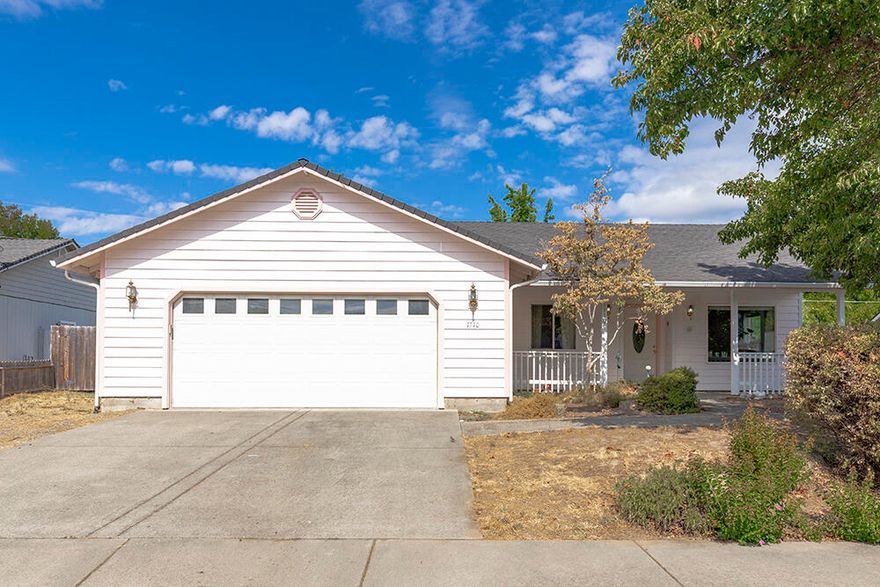 Welcome to 1710 Blue Moon Ln, a charming 3 bed, 2 bath home nestled on a quiet cul-de-sac in Grants Pass. This 1,448 sq ft residence offers both comfort and function with vaulted ceilings, skylights, and an open layout filled with natural light. The kitchen is well appointed with granite counters, a pantry, and plenty of workspace for the home chef. Relax on the covered front porch or enjoy outdoor living on the two covered back patios overlooking the large, fully fenced yard—perfect for entertaining, gardening, or pets. There's also space to store a small RV or boat, adding to the home's versatility. With a .19-acre lot and thoughtful design, this property blends style, convenience, and practicality in a highly desirable location.