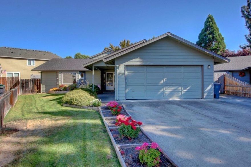 Incredible Opportunity Here on This Fabulous Single Level Custom Built One Owner Home Located on a Private Cul-de-sac in Excellent Central Point Location. This home is surrounded by Beautiful homes and is in the desirable school district 6. Large 1985 sq. ft., 3 bedrooms, 2 full bathrooms plus a fully permitted huge approx. 400 sq. ft. bonus room perfect for craft room/daycare/family room, etc. Upgraded Pergo laminate flooring flows through the entry, living room, and kitchen. Bright and open kitchen with vaulted ceilings, stainless steel appliances, and eating bar. Tiled floors in bathrooms and laundry room, energy efficient Vinyl windows, forced heat/air, newer roof, 2 car finished garage, + more. The backyard has 2 different garden areas with raised beds, in-ground sprinklers, mature landscaping, a custom arbor & water feature w/bench seating, a large wood deck, small shed perfect for storage & small RV parking that allows for boat & access to back yard along the side of the home.