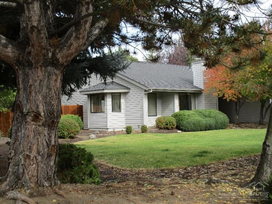 This truly is one of a kind in popular Ponderosa Estates. Single level, light & bright, vaulted ceilings, wood wrapped windows, river rock gas fireplace. Some upgrades in appliances, tile, glue-less laminate flooring, newer furnace w/AC, roof. This is a joy to see especially when there is a detached 14x33 RV garage plus attached 2 car garage w/220 & separate breaker box. Located on approximately 1/2 acre manicured yard with sprinklers. 8x12 garden shed, newer fence. If you're looking for storage here it is!