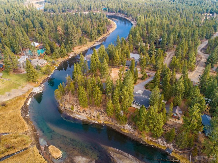 Nestled on a park like, landscaped .60-acre parcel directly on the Deschutes River. Unobstructed views in all directions. Enjoy long days on the dock or on the extensive paver patio. This lovely well maintained single-level home is 2581 square feet with an open floor plan offering formal and casual living space. Both living areas flow between a large kitchen with inviting island for family gatherings. The kitchen has a wall of windows all looking towards the river. The oversized master suite includes, two walk-in closets and a large office with private patio to the river. The attention to detail is endless, including a breezeway and potting shed. There is room for all your toys, with a three car, oversized garage with an estimated 500 sf bonus room. There are two additional storage buildings, 12x10 and 10x10. This property is not in a flood plain and no has HOA fees. Priced to sell and ready for you, your kayak and fishing pole.