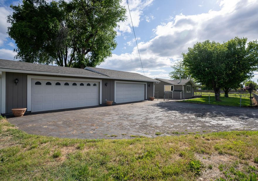 BACK ON THE MARKET WITH A NEW OWNER CARRY OPPORTUNITY AVAILABLE! Don't miss this rare opportunity in highly sought-after Central Point! This 3 bedroom, 1 bath home sits on just over 2 flat, usable acres—fully fenced and cross-fenced, perfect for animals. The property features a spacious 4-car garage/shop, barn area, ample storage, and a paved driveway with plenty of parking. While the home could use some TLC, it's a great fixer-upper with tons of potential. Enjoy beautiful mature trees and breathtaking views of Mt. McLoughlin. Country living just minutes from town—bring your vision and make it yours!