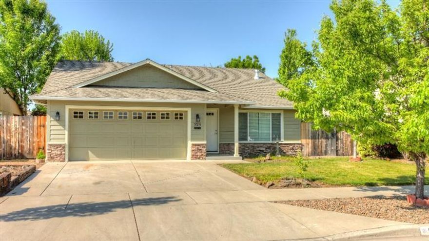 This wonderful home in the Hampton Place Subdivision is ready for you to move right in! Built in 2004 and well maintained since, the interior was just painted, carpets cleaned and the exterior was spruced up with paint, landscape cleanup and more. The home is light and bright with a welcoming layout. Vaulted ceilings in the living room and kitchen add to the spacious feel while a gas fireplace adds warmth and ambiance through the winter months. The kitchen opens to a large dining area that continues onto a huge covered patio. Bar seating is an extra bonus! The master suite is complete with a vaulted ceiling, plant shelving, walk-in closet and patio access. On top of the great patio, you'll also enjoy a private backyard and mature landscaping. Clean, move-in ready and a great family neighborhood; don't wait to tour this great home, it won't last long!