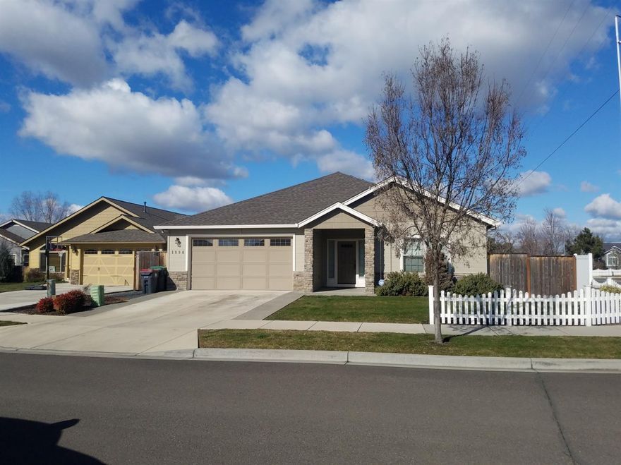 Huge Reduction with motivated sellers on this Stunning Newer Craftsman Style Home on large landscaped corner lot. Come see this 1754 sqft home 3 bed room 2 bath with open and split floor plan. Home was built with added square footage so larger rooms vaulted ceilings with ceiling fan through out home. All new window coverings with warranty included. Hardwood floor in all living areas. An open kitchen with beautiful granite counter tops and island. Cabinets throughout the home are Alder wood and very high quality as the home was built by one of the best builders in the area. Vinyl fenced yard for easy maintenance and nice patio in backyard wired for audio as well as CAT5, HDMI, and audio wired throughout home. Too many upgrades to list..You need to come see this home to appreciate all of the amenities and quality. Call for your appointment today.