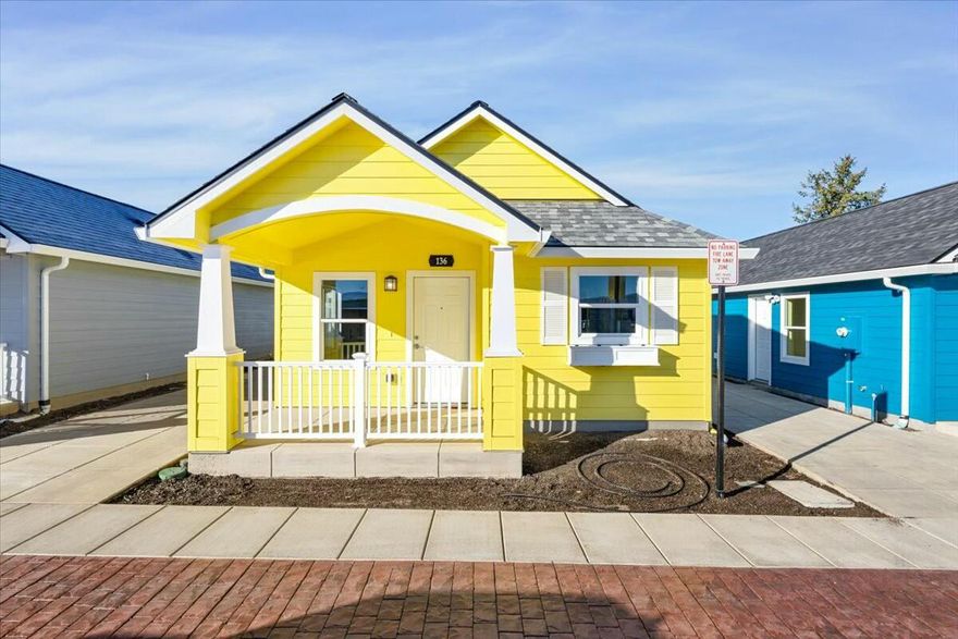 New Spirit Village is a visionary community offering affordable homeownership through thoughtfully designed new construction homes. These charming 1-, 2-, and 3-bedroom frame-built residences feature cottage-style exteriors, inviting covered front porches, modern open layouts, private fenced yards, and scenic cobblestone streets. Adjacent to the 8-acre Lewis Park, residents enjoy outdoor amenities such as a running path, playground, ball court, natural creek area, and expansive open lawns for recreation and relaxation.  Everyday conveniences, including grocery stores, restaurants, and bus stops, are less than 1/4 mile away. New Spirit Village operates on a pay-it-forward model, offering homes at below-market prices. To ensure affordability for future generations, homes are resold below market value. Long-term affordability is maintained by holding the land in a not-for-profit Community Land Trust, with resale, owner-occupancy, income, and other restrictions in place.