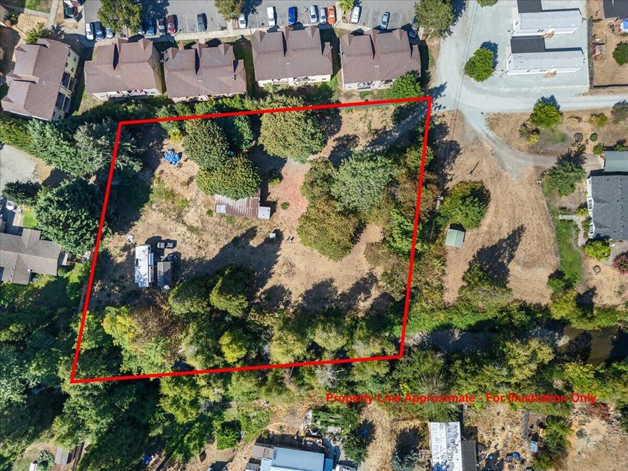 Charming property located along a beautiful year-round creek in Canyonville, Oregon. Situated on just over an acre of fenced and flat land, this gated and private retreat offers endless possibilities. The property is on a well and connected to public septic, making it ready for your vision. The current home can be remodeled to suit your style or replaced with a brand-new manufactured home. Full RV hookups provide convenience for guests or travel enthusiasts, and an old in-ground cellar adds a touch of rustic charm and storage options. Imagine relaxing by the creek, enjoying the soothing sounds of flowing water right from your own backyard. With its combination of privacy, usability, and natural beauty, this property is a rare find for anyone seeking a peaceful rural lifestyle while staying close to the amenities of town. Whether you're looking for a weekend getaway or a full-time residence, this location offers the perfect foundation to build your dream.