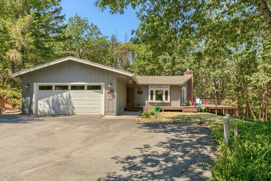 Peace and serenity abound when you relax on the expansive wrap around deck of this quaint oasis in the trees. Sitting on an acre off a quiet lane, this is the perfect rural property for the discerning buyer who wants privacy but also wants to be close to town. When you come inside, light flows into the living room through three sets of French doors keeping it light and bright even during winter months when you are snuggling up in front of your gas fireplace. Solid oak floors and a large kitchen with a newer stove, dishwasher, refrigerator and garbage disposal are just a few of the additional amenities in this beautiful country home. Plenty of room for your RV and Toys!