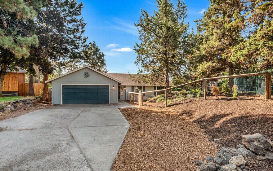 Peacefully located on a large lot with mature trees, on a quiet cul-de-sac, and in an established Bend neighborhood. With hardwood floors, wood burning stove, vaulted ceiling, and skylights this home is the perfect combination of cozy and bright. The home has everything you need with tastefully updated bathrooms and kitchen with stainless steel appliances. Outside you will find a fully fenced yard, and a brand new deck for enjoying our Central Oregon living. A few of the owner's favorite things are the wonderful neighbors and quiet neighborhood and being able to walk through the neighborhood to Canal Row Park. Less than a mile to Hollinshead Park and less than 2 miles to Midtown Yacht Club and so much more. Centrally located and close to everything. All of this and a Home Energy Score of 10/10. Come check it out.