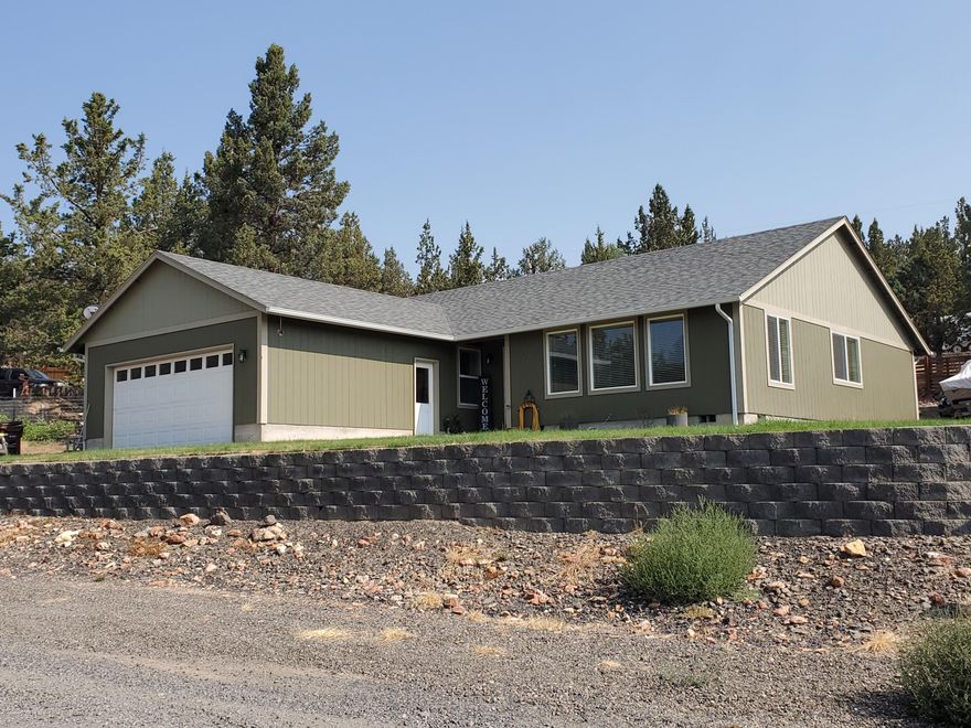 Your new home in Ochoco West is a 1704 sf, 3 bedroom, 2 bath on a corner lot.  This home comes complete with a large living room, dining area, breakfast nook, large master suite, and 2 car garage.  A Mitsubishi heat pump keeps you cool in the summer and warm in the winter.  Each room also has a cadet heater to keep you extra toasty.  From the front yard you have peek-a-boo valley views.  The exterior also boasts underground sprinkler system in the front, lots of parking, a good sized storage shed and a back deck.  Owning a home in Ochoco West gives you access to locked RV storage, horse barn, clubhouse, swimming pool, ATV trails, shooting range, fishing pond and more.  Exterior painted within the last 5 years and new gutters installed.  (Range/oven is less than 1 year old.)  Buyer to do their own due diligence regarding all aspects of this property.