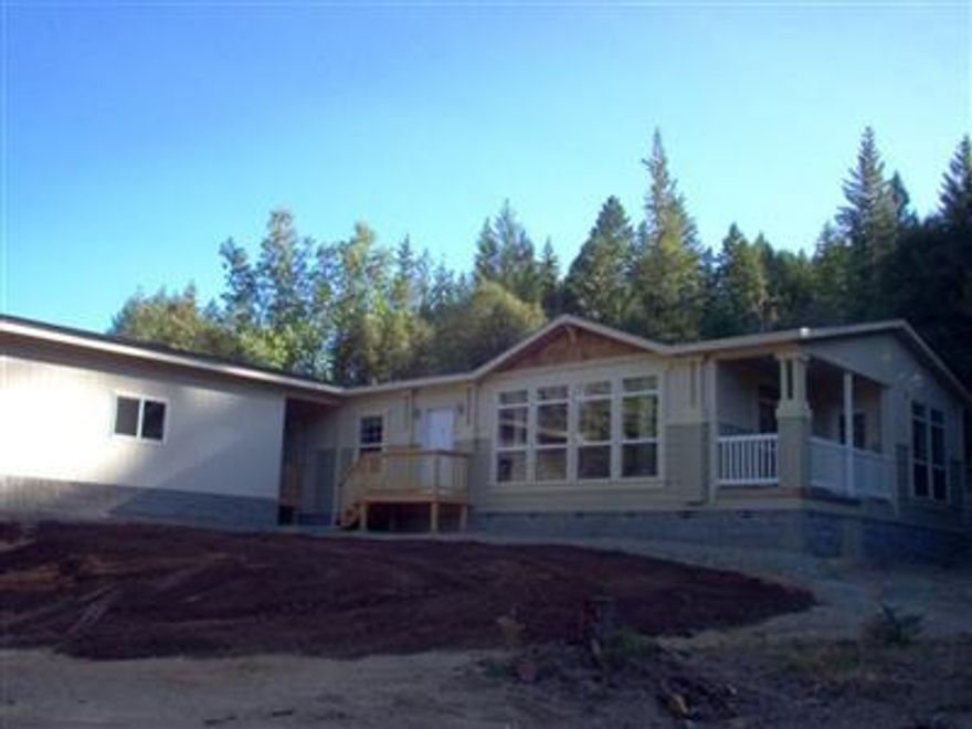 INVESTORS! Owners say SELL! Are highly motivated-Submit all offers! Take advantage of extenuating circumstances...never lived in 2004 1,710sqft 3bd/2ba Goldenwest manufactured home with a new 2-car garage attached by a breezeway. Wooded 5.69 acre parcel with creek running through. Recent incident has left home with approximately $10K worth of work to re-do. Owners say let's make it work.