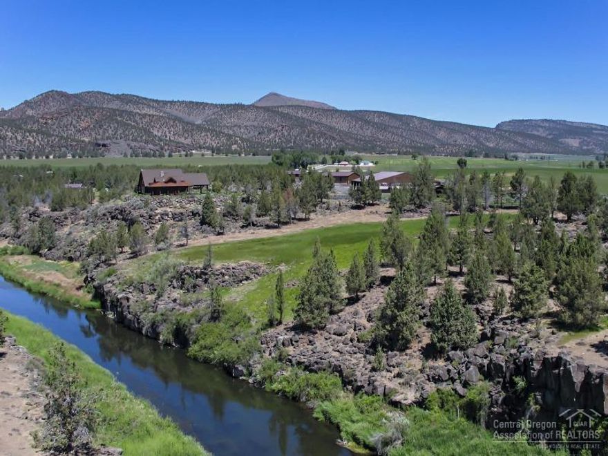 Exceptional well appointed Equestrian Estate on 105.66 acres in the Lone Pine Valley. The Crooked River runs thru the property with 3/4 of a mile of river frontage & access. Stunning Smith Rock, Cascade Mountain or River Views from each room. Custom NW style home is 4773 sf, 3 bedroom, 4 bathroom with quality finishes and amenities throughout. Property: top quality equestrian facility, managers home, studio/office, 64x48 heated shop/RV garage, hay/equip shed, horse barn, 100x150 covered arena and wildlife.