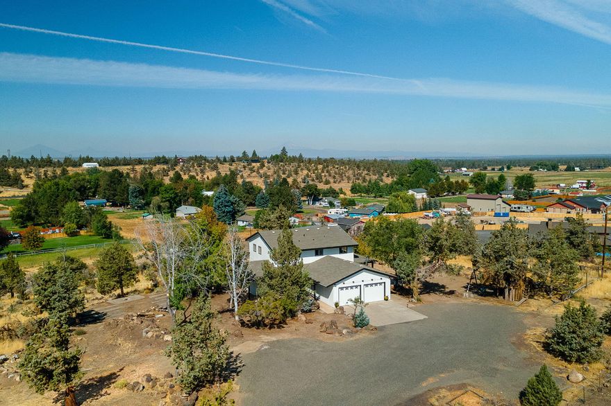 Fantastic Location and Views from this updated 4 Bedroom home in NW Redmond.  1.99 Acres with mountain views.  One of the largest parcels in La Casa Mia.   Updated bathrooms and kitchen, new flooring and septic system.   Hill top views and Very private location bordering common area and larger parcels.
