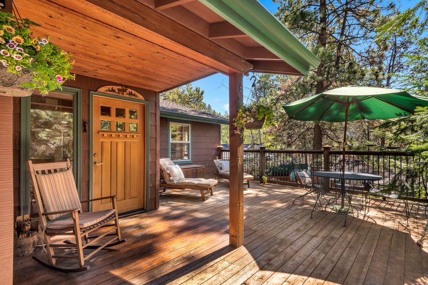 Cabin in the woods! Located in the heart of Bend's Westside. Tucked beneath gracious ponderosa pines, this beautiful custom home features red oak hardwood floors, cherry cabinets, stainless steel appliances, solid wood doors and wood trim. Incredible single level floor plan with a private all inclusive room downstairs with a private bath and entrance. This private retreat has a water feature, multiple outdoor paver courtyards and private decks including a wood burning fireplace. The huge 45 ft deep paver driveway features covered RV parking and leads to an oversized 3 car garage with pull through garage doors on one side for additional RV or toy parking. A workshop and multiple storage buildings complete the unique oasis.