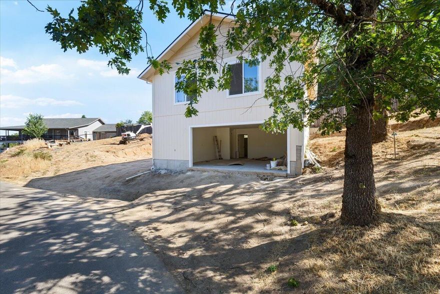 New Construction in Prime Location! Welcome to 416 SE Grandview Ave. where brand new construction meets value and style. This upper-level home has 2 bedrooms, 1-1/2 baths, laundry and a pantry. Enjoy features such as open concept, primary suite with gorgeous views from its private balcony, kitchen designed for function and entertaining with a partial view lot. Entry level provides a 2-car garage and ADDITIONAL office/guest quarters with a separate entrance and full bath (could be used as a 3rd bedroom or in-law suite). Construction should be completed towards the end of July!