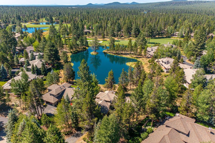 Perfectly positioned on a large pond overlooking the Woodlands golf course in Sunriver, this furnished, warm and welcoming home is the perfect backdrop to your favorite memories to come. Soaring ceilings, skylights and abundant windows flood the main living area with natural light. From here, enjoy access to a spacious deck & views of the water and soaring pines beyond. A double sided wood burning fireplace sits at the core of the home,  providing warmth to the living and dining area. The updated kitchen includes generous counter space, center island with breakfast bar and access to the deck that make this the ideal gathering spot for family and friends. The primary suite boasts panoramic views of the pond, golf course and forest, as well as a large bath with soaking tub. With 2 guest bedrooms plus office/bonus room, this is a delightful home base for all that Sunriver offers; golf, tennis, Deschutes River access, aquatic center, horseback riding and over 40 miles of meandering paths.