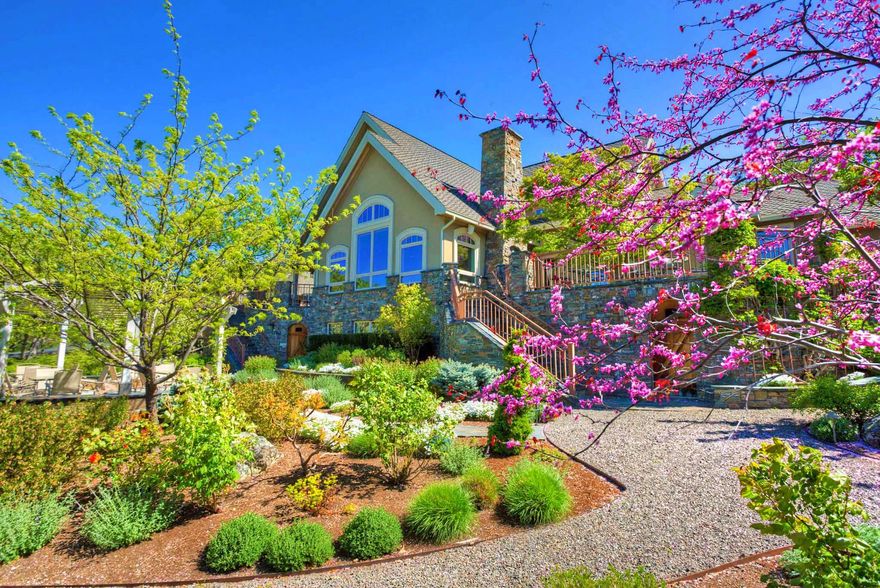 Family estate on private irrigated acreage in the foothills of Grizzly Peak nearby Emigrant Lake, just 7 miles from downtown Ashland. Understated accents, clean lines, walls of windows, soaring ceilings, and uncompromised quality of finishes showcase the craftsmanship of renowned builder Clay Colley. Main level features a luxurious master suite, gourmet kitchen, formal dining room, family room, great room, half-bath, den, and office. Upper level has three additional bedrooms, sitting area, and two full baths. Finished lower level with spacious media/play room, full bath, safe room, and abundant storage. Above the 4-car detached garage and conditioned workshop is an additional 1,000+ sq. ft. guest apartment. This dynamic property is fully landscaped with deer-fenced gardens, courtyard, fountain, seasonal patios, and ~1400 sq. ft. of composite decking to enjoy outdoor entertaining and panoramic views. Inquire with agents to experience this elegant home in person or request details.