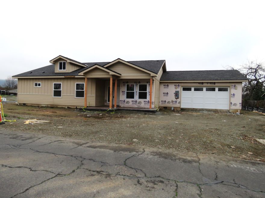 The purchase of a new home is always exciting~ but what make's it even more exciting~  is when it a BRAND NEW HOME!  No extra cleaning to move in... nobody else ideas of décor or color schemes to deal with~ it's all yours from the start!  Now couple that with a great, convenient location and you've really got a winning combination!  That and more is what you'll find at 1322 Orchard Home Dr. Medford.  More amenities like: beautiful exterior stone accents, vaulted ceilings in living room and primary bedroom, dual vanities in the primary bath, granite counters throughout, all stainless kitchen appliances (including kitchen fridge) terrific tile showers with glass doors, fully landscaped front and back with automatic timers, and a wonderful fence to frame the back yard.  Perfect!  Act now (by drywall phase) and you can choose from a variety of provided color schemes ~ for a truly custom look, that's reflects your tastes and style!