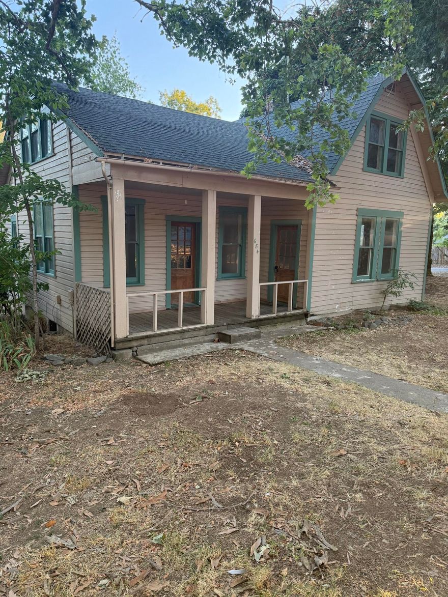 Charming older craftsman style home on a large .23 acre lot.  Beautiful tree covered corner lot. 1912 sqft 3 Bedroom 1 Bathroom  Detached 1 car garage and lots of room for RV parking. Could be a garden paradise with the right person.