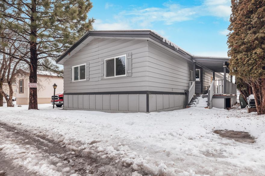 This beautiful 3 bedroom, 2 bath home boasts a coveted split floor plan and a recently renovated kitchen with stainless steel appliances. The residence has undergone an extensive series of updates, including new flooring, an upgraded guest bathroom, a newly remodeled covered porch, fresh interior and exterior paint and a newer central heating system. Current space rent within the park set at just $635, covering water, sewer, and garbage services. The home also offers ample storage shed space and features a wood-burning stove. The convenience of a washer and dryer is also included. Situated just minutes away from shopping, dining, and more, this home provides a perfect blend of comfort and accessibility. Additional guest parking is conveniently located nearby. Schedule a private showing today to explore all that this home has to offer!