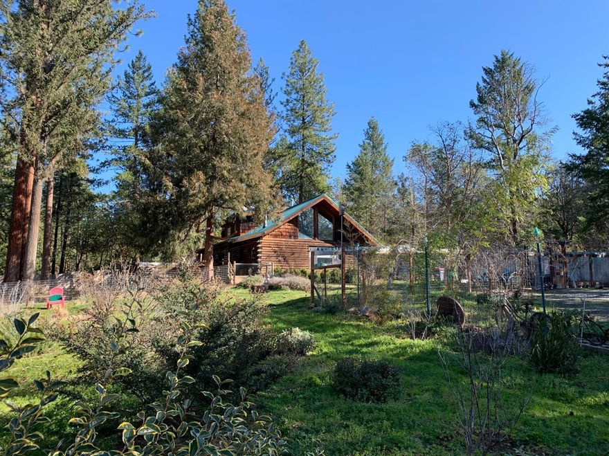 Private little oasis near Ruch, out of winter fog but only 15 min from Jacksonville. Sweet log home on 1.54 acres features large open floor plan with vaulted ceilings, entire upstairs is the master suite with balcony to back yard. Covered front porch to sip your morning coffee and enclosed back deck used as a dog run w/fully fenced yard area for your dog to play. Huge garden area is deer fenced and planted with lots of perennials. Lots of sheds and outbuildings for equipment storage. Great well, last tested at 12.11 gpm. Located in the heart of the Applegate wine trail.