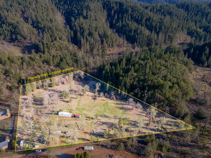 Enjoy all the beauty Southern Oregon has to offer on this picturesque and ready to build, 6.68 acre parcel. The great parcel already has spring water, septic, power, and Montgomery Creek flowing in the bottom. Best of all it comes with a 480 SF shop/barn and multiple other outbuildings. Make this property yours to enjoy, and all for under $190,000, and you're less than 25 minutes from town! Existing manufactured home has no value. Call for your tour today!
