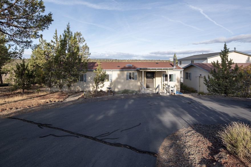 Fabulous Deschutes River Canyon Location for this unique duo:  Huge 3 story shop that includes a bath and two rooms for guests, hobby, office, etc and manufactured home in excellent condition on a paved road. 

If you love adding your own touches, you will love the opportunity to update to your hearts desire.  Must see this Canyon home to take in the beauty of the surrounding Basalt Canyon Walls and Deschutes River Below.  Views of the Cascades to the south.  Marvelous location on paved road.  

And all that Crooked River Ranch has to offer:  golf, swimming, fishing, tennis, pickle ball, hiking, parks, restaurants, clubs, abundant wildlife and rich community life.  Close to Central Oregon recreation, shopping, restaurants and the rich urban vibe of Bend.